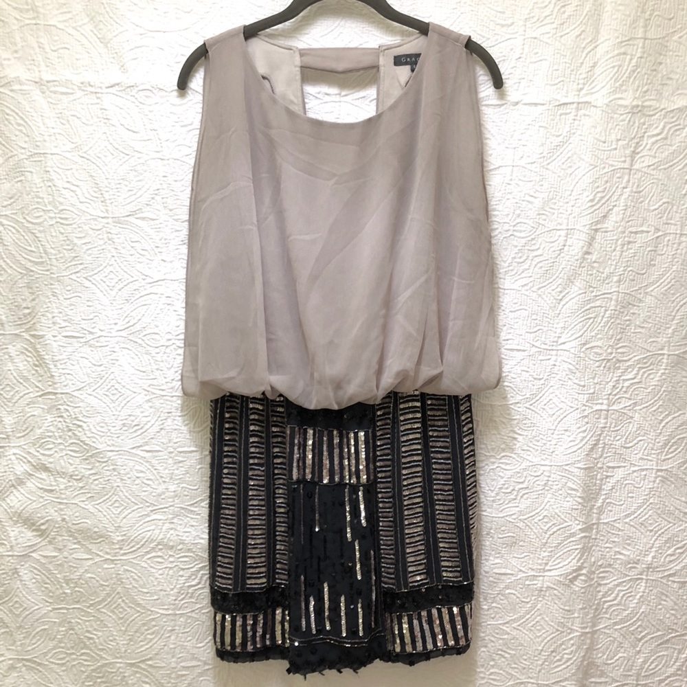 Sequin/two-tone mini dress with plunge back.